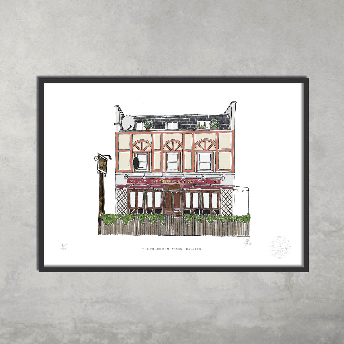 The Three Compasses – Limited Edition of 50 A3 Colour Prints by 45 Original features the iconic Hackney pub’s red and beige exterior, fenced patio, and greenery—giclée fine art print shown on a plain gray wall.