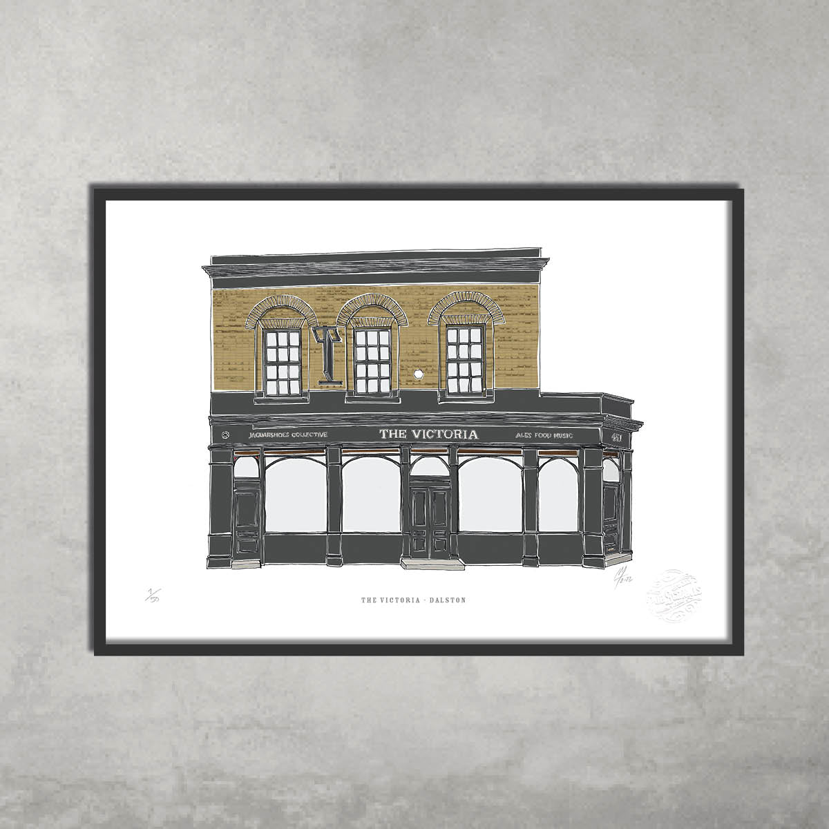 The Victoria – Limited Edition of 50 A3 Colour Prints by 45 Original features a two-story brick building with arched windows and doors—ideal for art lovers or Hackney Pub Crawl fans. Framed, set against a plain light gray wall.