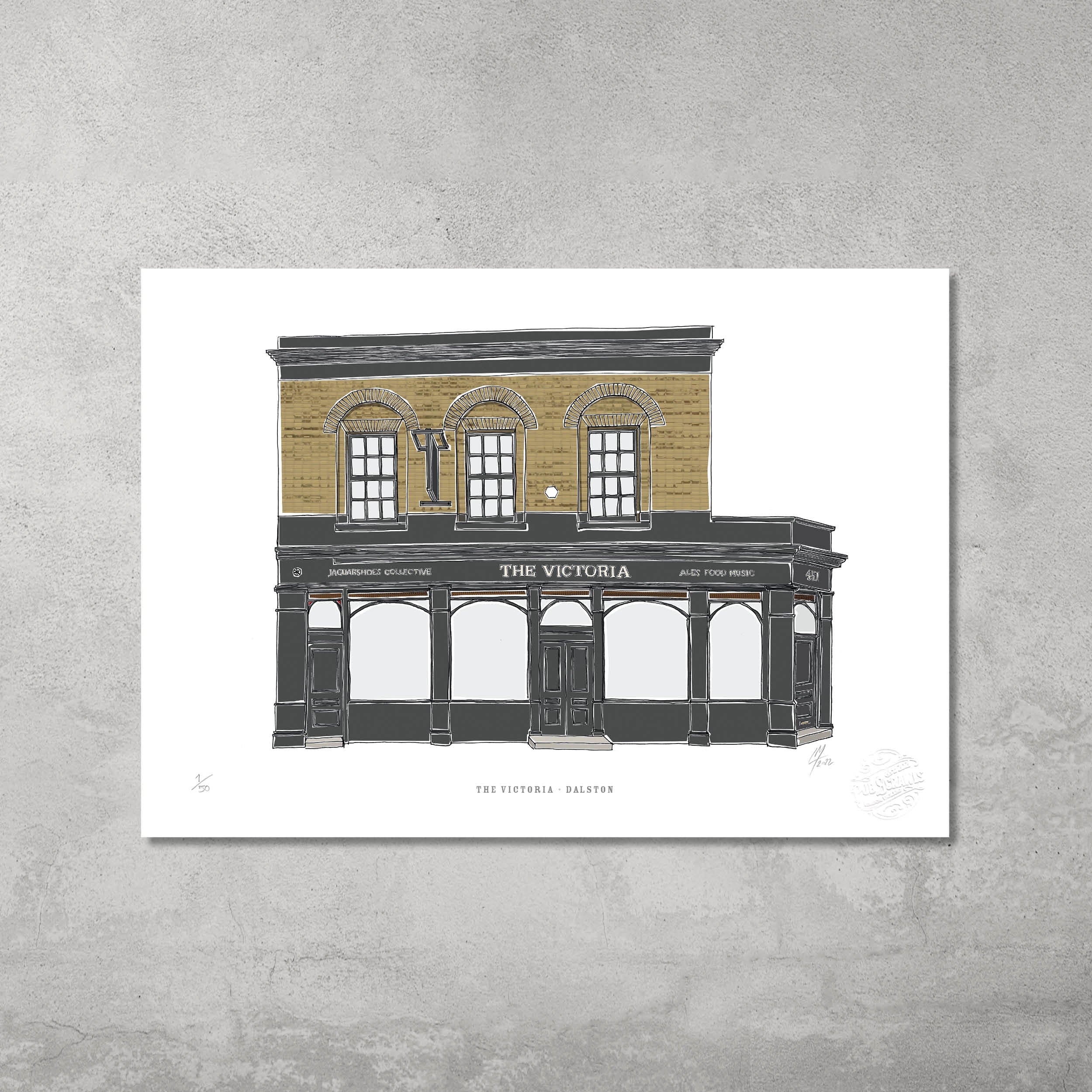 The Victoria – Limited Edition of 50 A3 colour prints by 45 Original features a two-story Dalston pub, perfect for Hackney Pub Crawl fans. Displayed against a light gray wall, this print is a must-have for pub lovers.