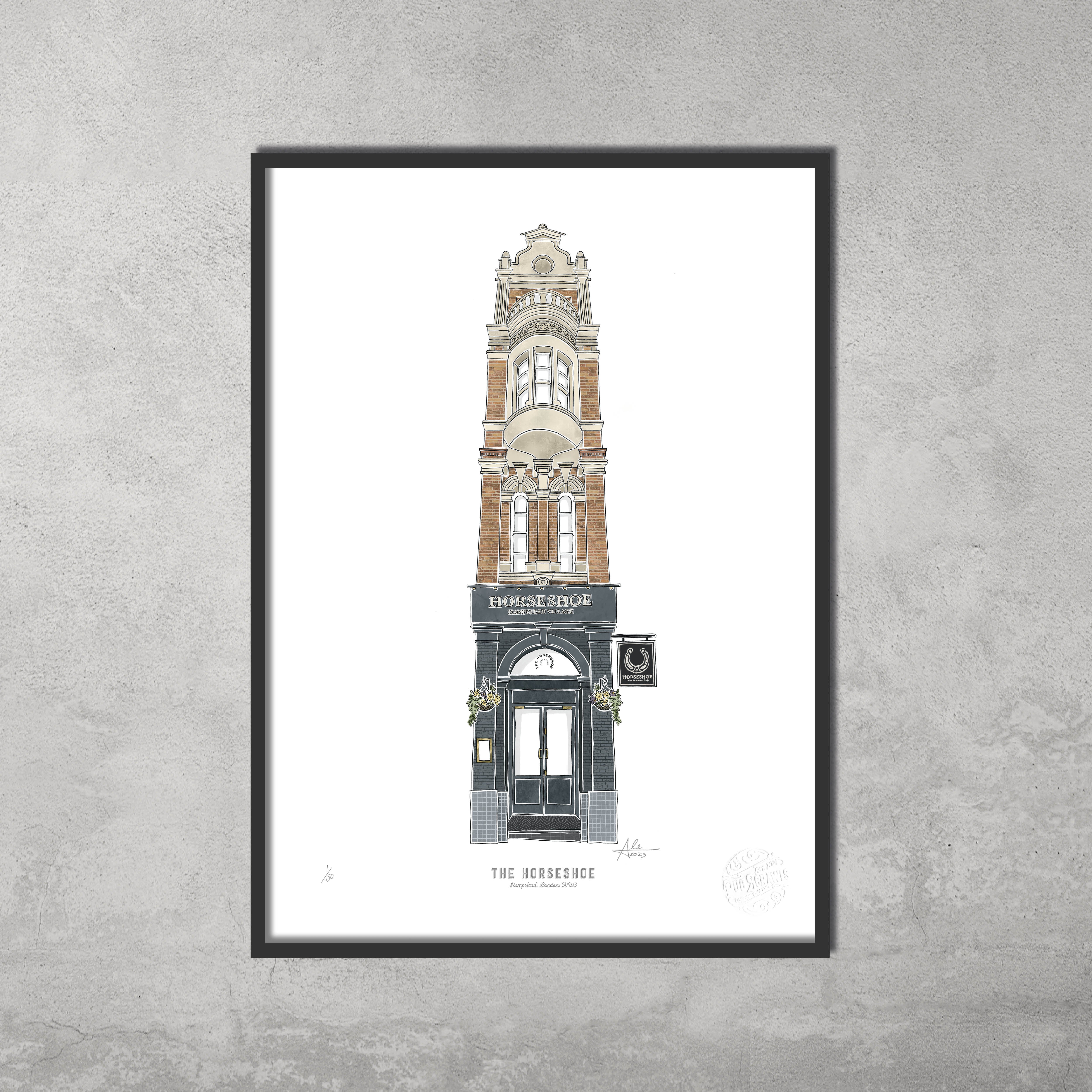 The Horseshoe – Limited Edition of 50 A3 Colour Prints by 45 Original: a framed giclée print of the iconic tall brick pub, ideal for Hampstead & Highgate Pub Crawl fans, displayed on a gray textured wall.
