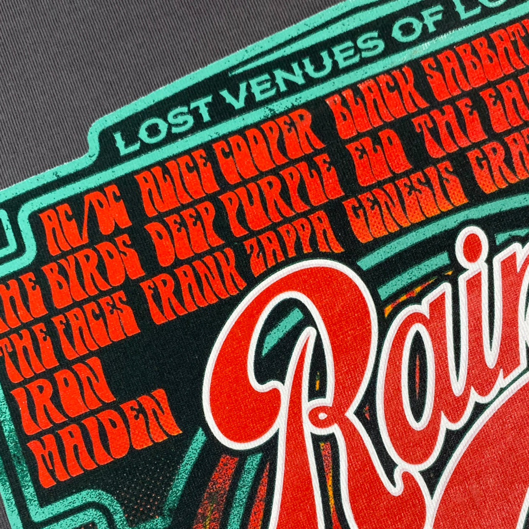 Limited to only 100, the My Store Rainbow Rock T-Shirt features bold orange band names inspired by legendary acts like AC/DC, Alice Cooper, and Iron Maiden—celebrating the iconic London venue’s storied past.